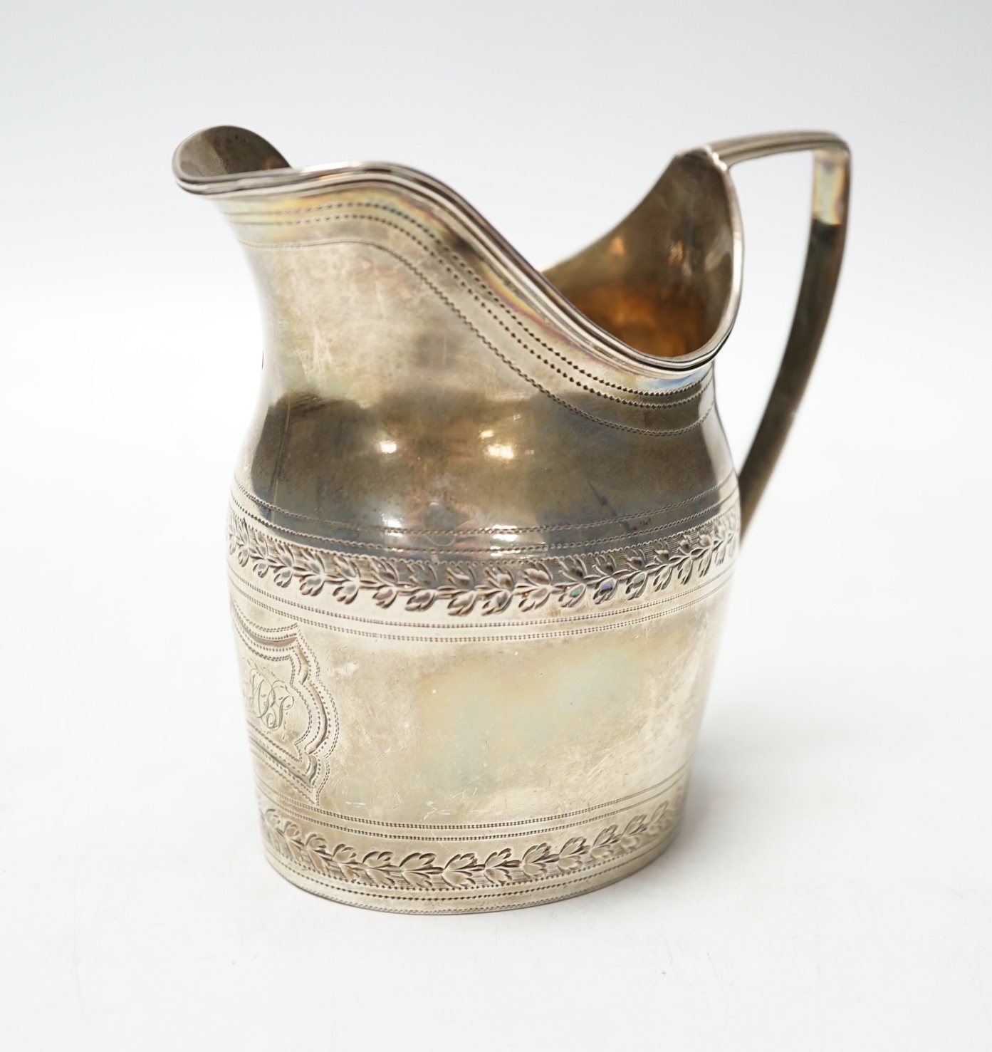 A George III silver engraved helmet shaped cream jug, Godbehere & Wigan, London, 1796, 10cm, 5.3oz.